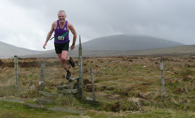 Geoff Scott smiles for the camera mid-leap - photo: Pat